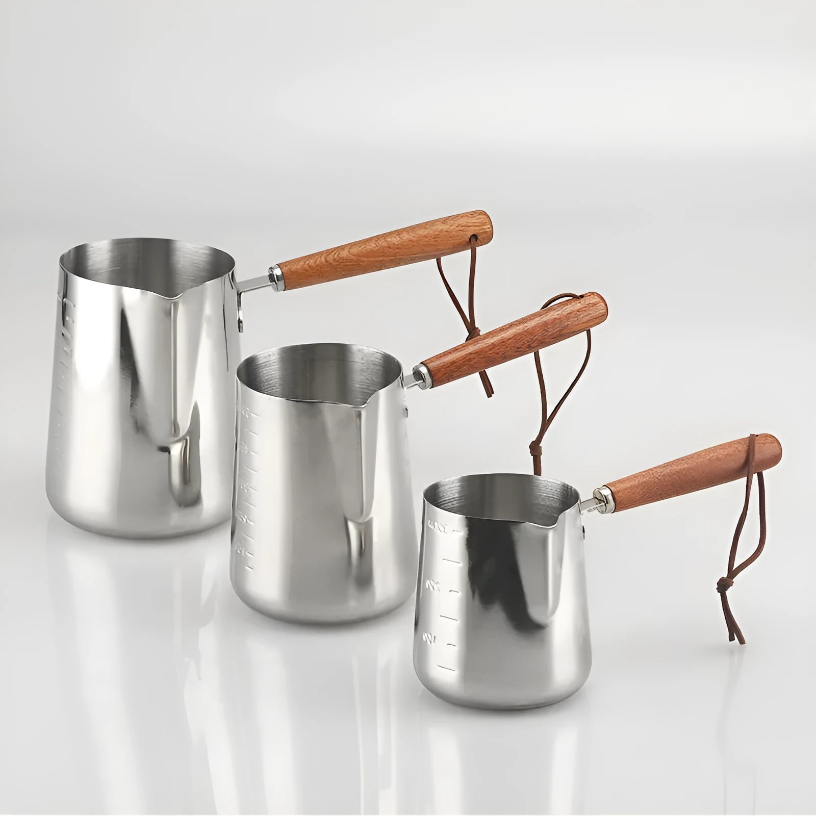 Stainless steel coffee cup with wooden handle shown in simple solid colour, available in 350ml, 600ml or 1000ml capacities.