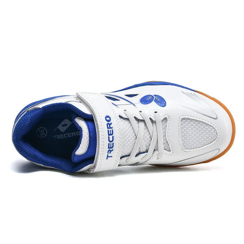 White and blue PVC low-top badminton shoes with hand-painted detail and a ribbed sole.