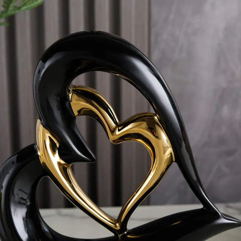 Modern geometric heart ornament in metallic finish displayed on shelf