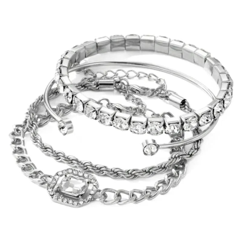 Gold and silver alloy square diamond geometric jewellery set with bracelet and pendant on a white background.