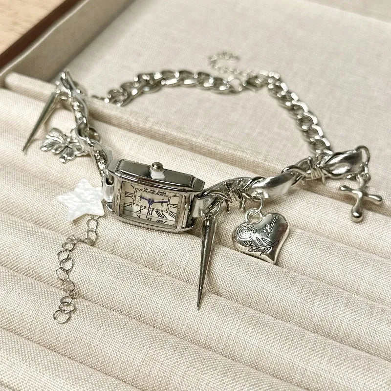 Dark multi-layer cross necklace with twin clavicle chains showing adjustable length and alloy construction