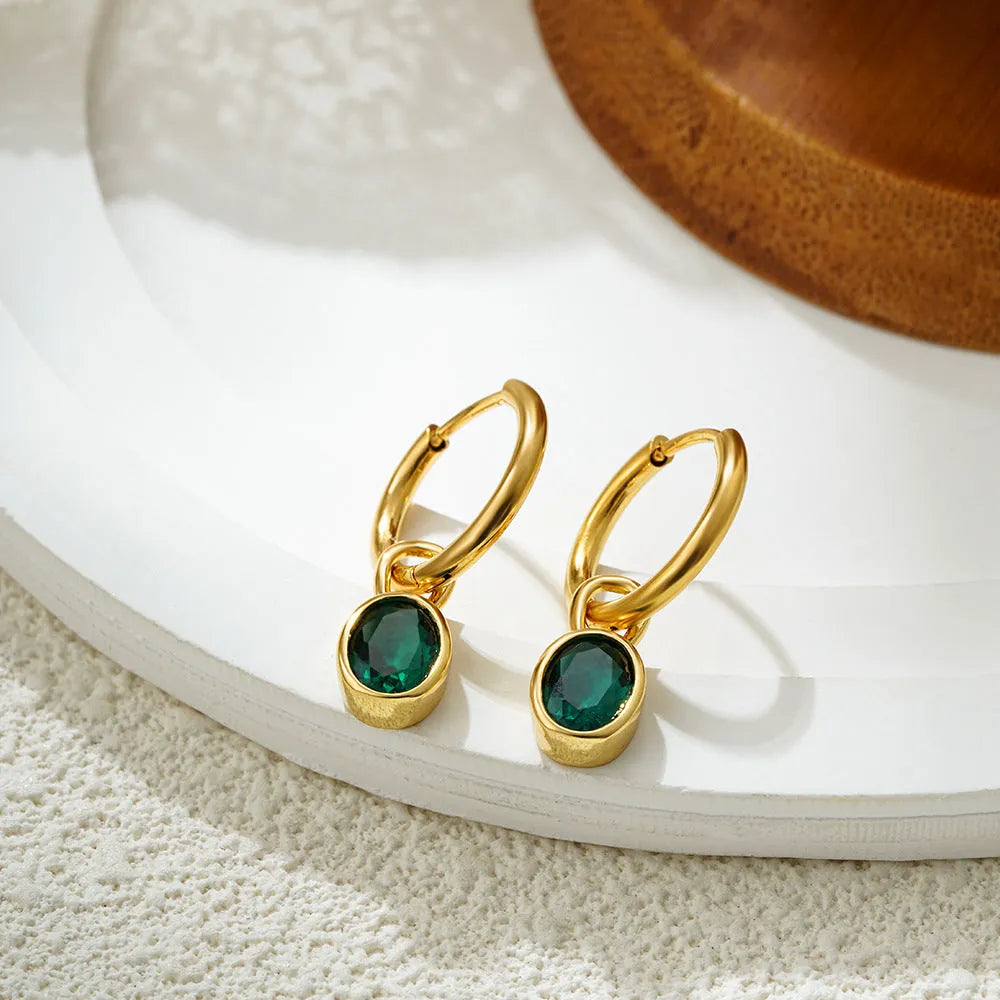 Women's retro oval zircon drop earrings in copper, shown in army green colour.