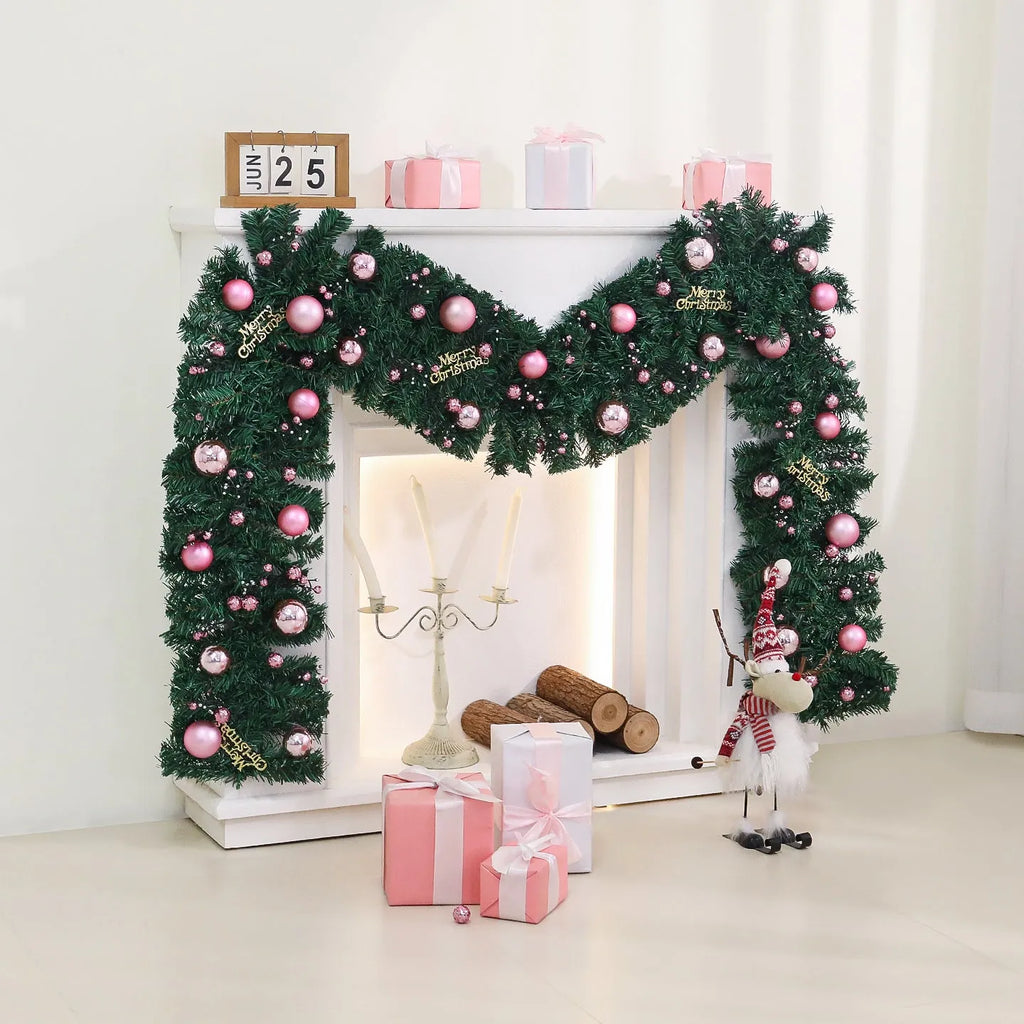 2.7 metre long pink Christmas rattan decoration with 240 decorative heads draped on a mantelpiece