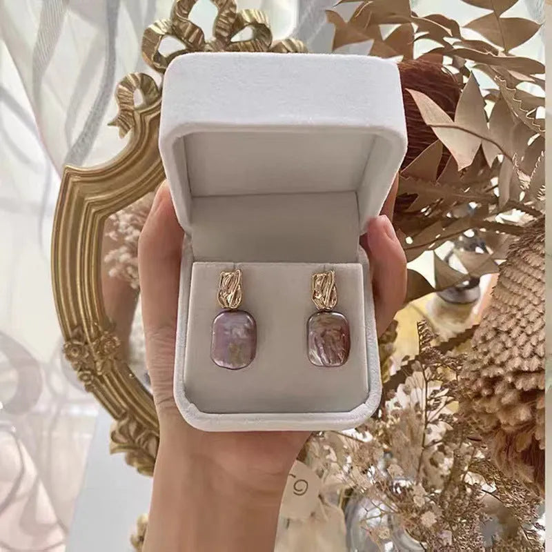 Square freshwater pearl stud earrings with geometric quadrilateral faces in purple, white or pink colours