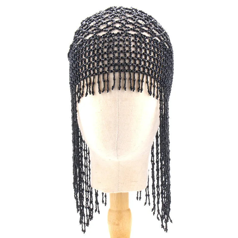 Silver belly dance hat with beaded tassels on black background for performance hair ornament