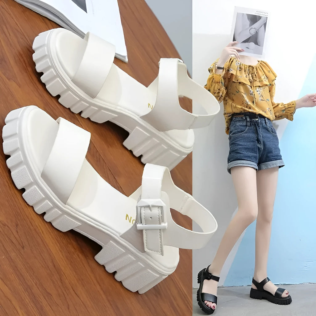 Women's beige peep toe sandals with an ankle strap buckle and a platform sole, shown from the side.