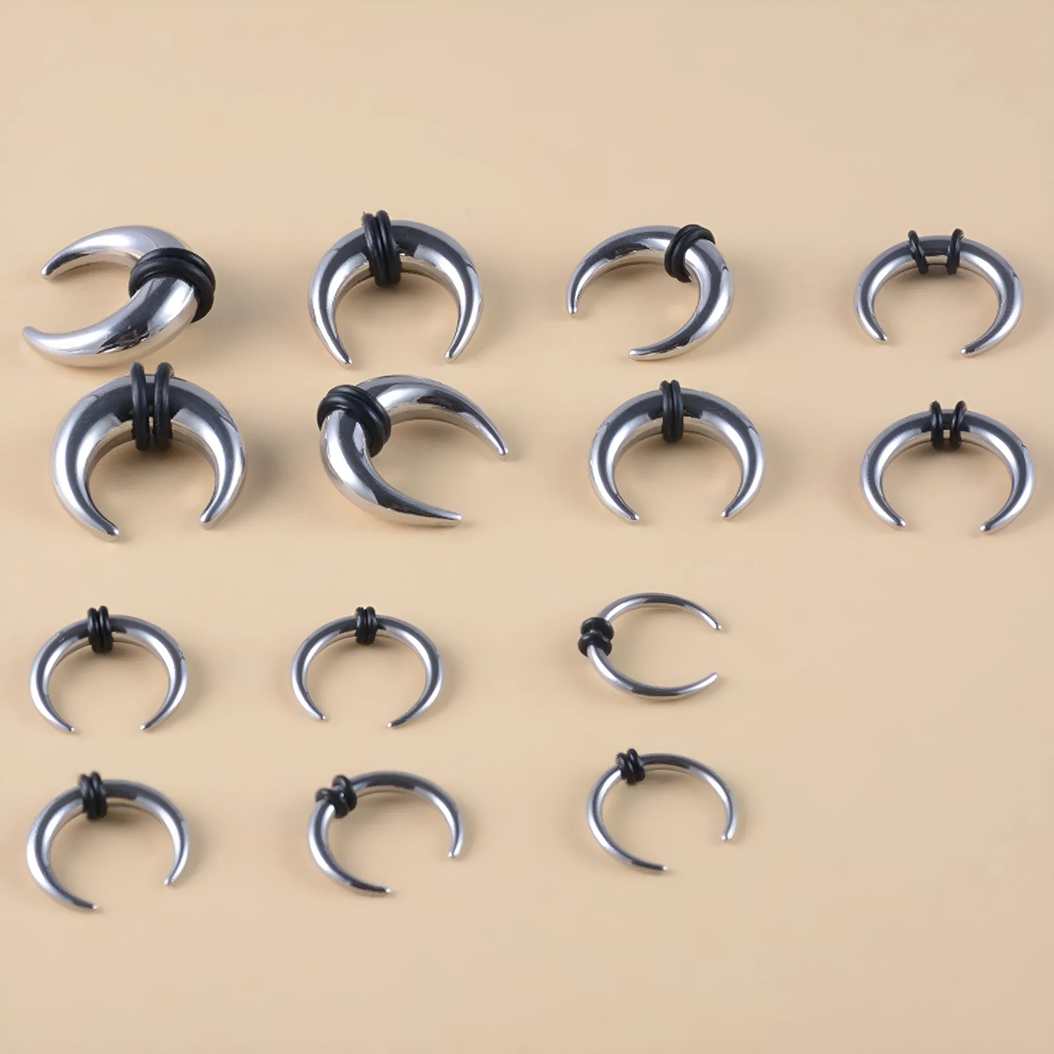 Close-up of a C-shaped buffalo horn style nose ring made from 316L stainless steel, showing steel colour and black finish options.