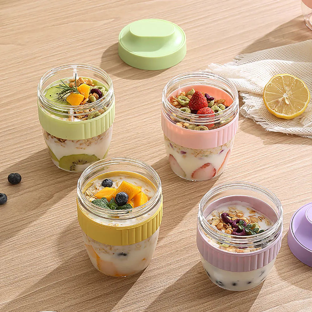 Green plastic salad cup with clear lid and integrated spoon showing 480ml capacity measurement