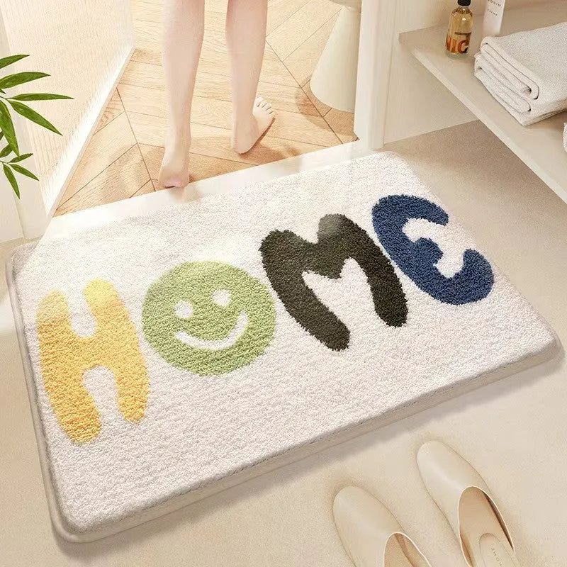 Rainbow pattern floor mat in sky blue and white colours with a flat polyester pile and plastic backing.