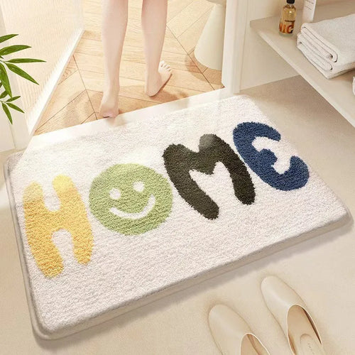 Rainbow pattern floor mat in sky blue and white colours with a flat polyester pile and plastic backing.