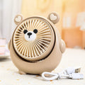 Small plastic desktop fan with a cute dog design, showing USB port and control buttons.