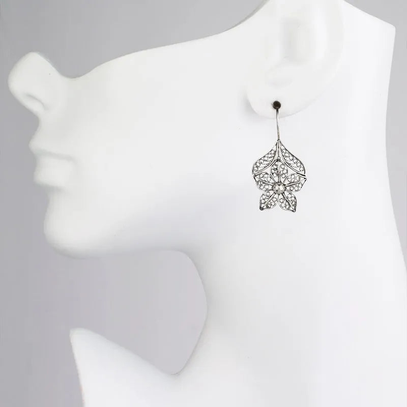 Silver alloy hollow flower leaf-shaped women's earrings with retro floral metal design