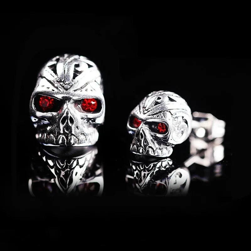 Retro skull stud earrings with red eye detailing on alloy metal with electroplated finish