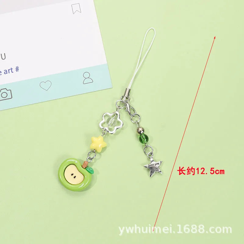 Fruit-themed mobile phone charm keychain with apple and strawberry designs in plastic/resin construction