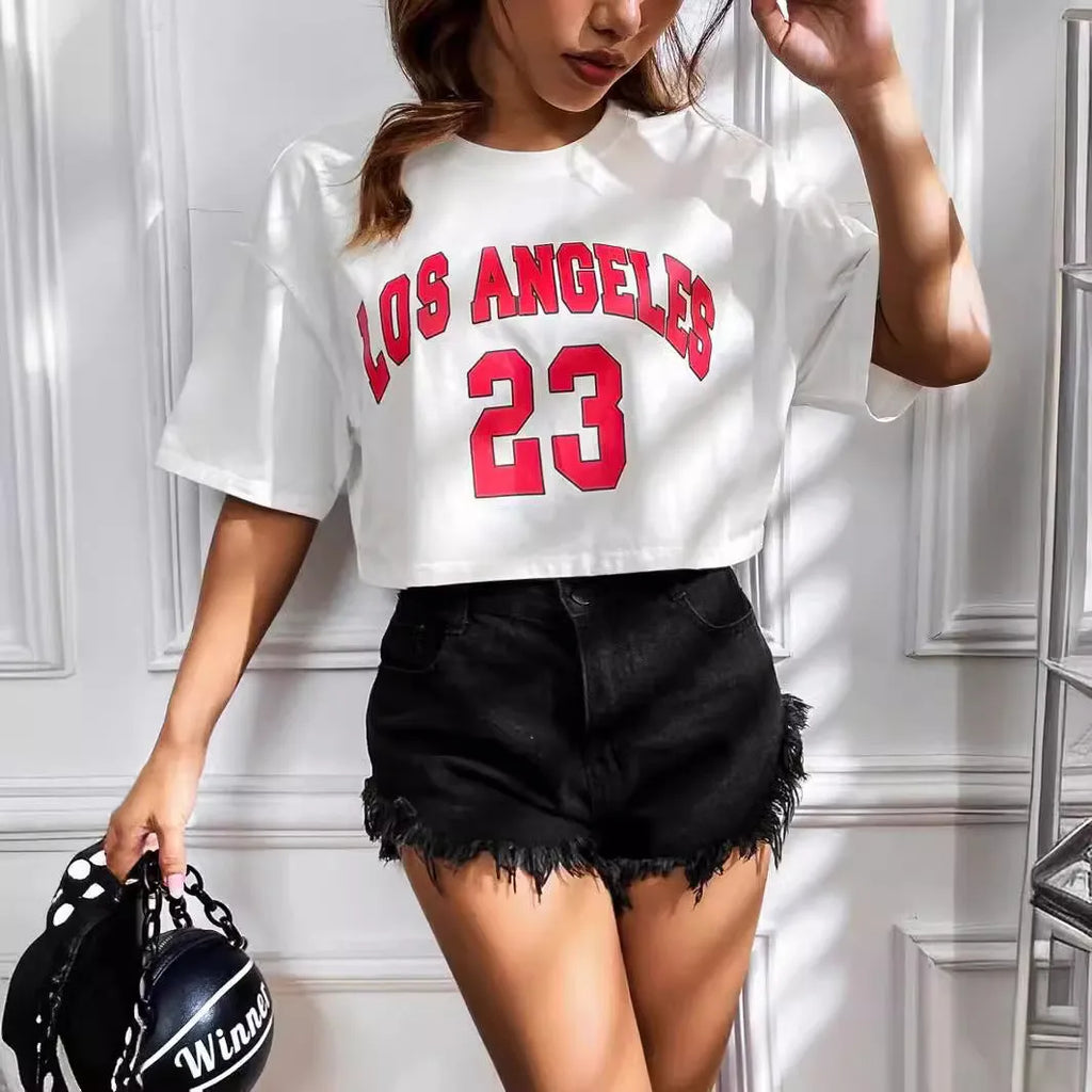 Women's black loose fit cotton T-shirt with exposed navel design and printed white English letters.