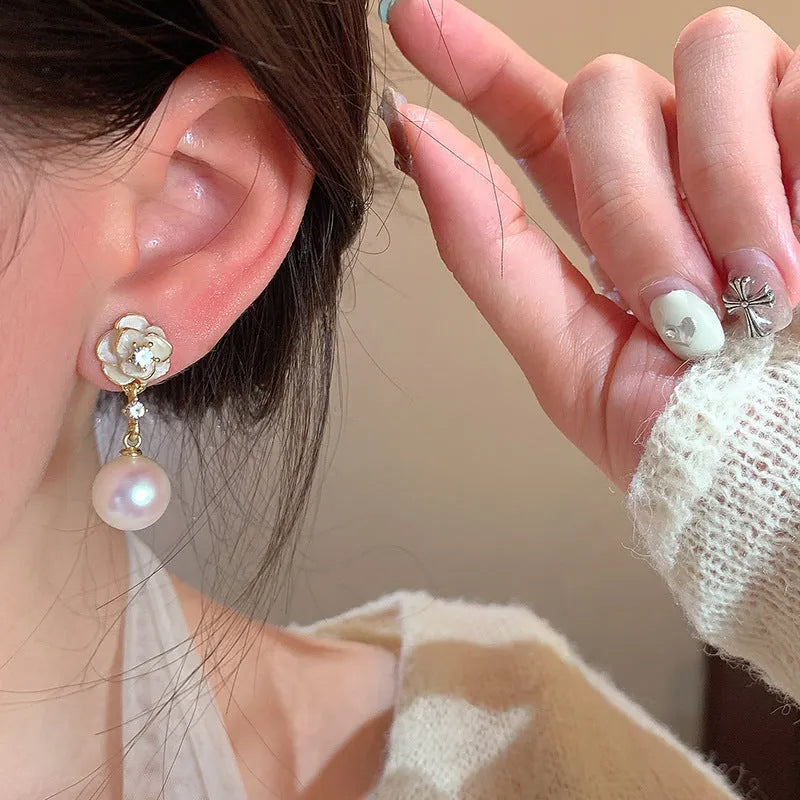 Camellia flower stud earrings with alloy construction and floral detailing