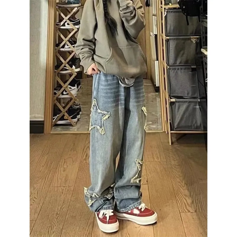 Blue high-waisted straight-leg women's jeans on a hanger, showing the front and back design.