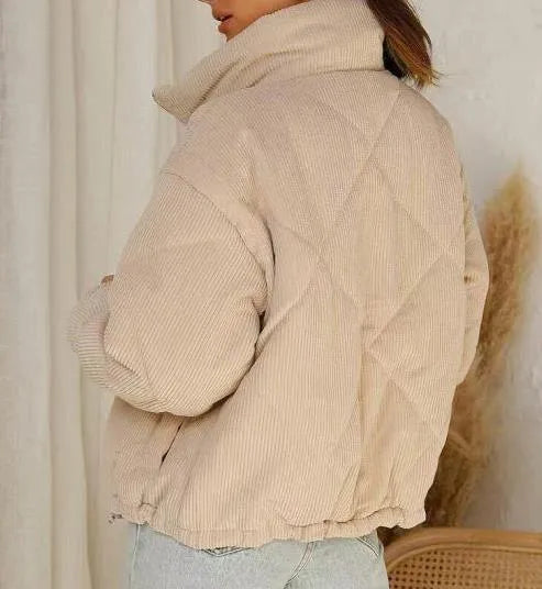 Apricot coloured women's corduroy jacket with a stand collar and zip-up front.