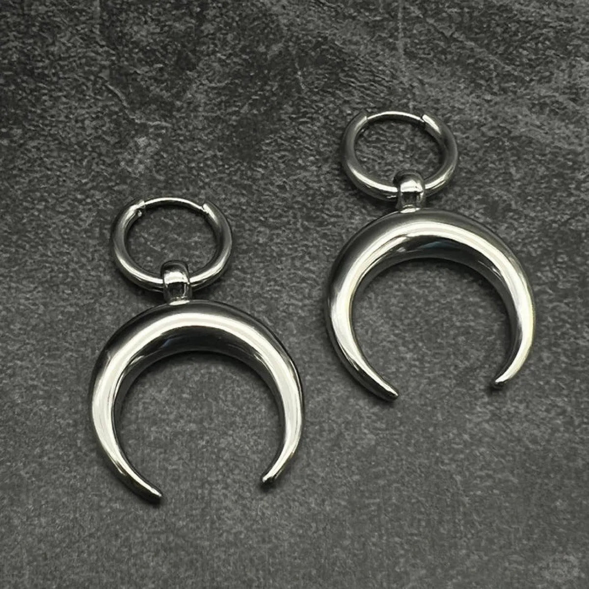 Silver geometric hoop earrings with moon detail and clip-on back