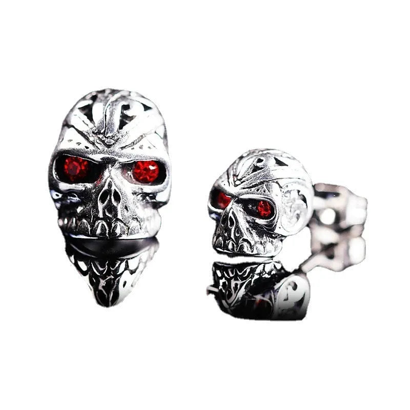 Retro skull stud earrings with red eye detailing on alloy metal with electroplated finish