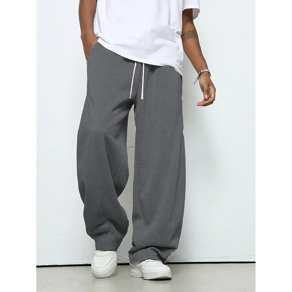 Men's solid colour polyester trousers with straight leg and drawstring waist in black, dark grey, light grey