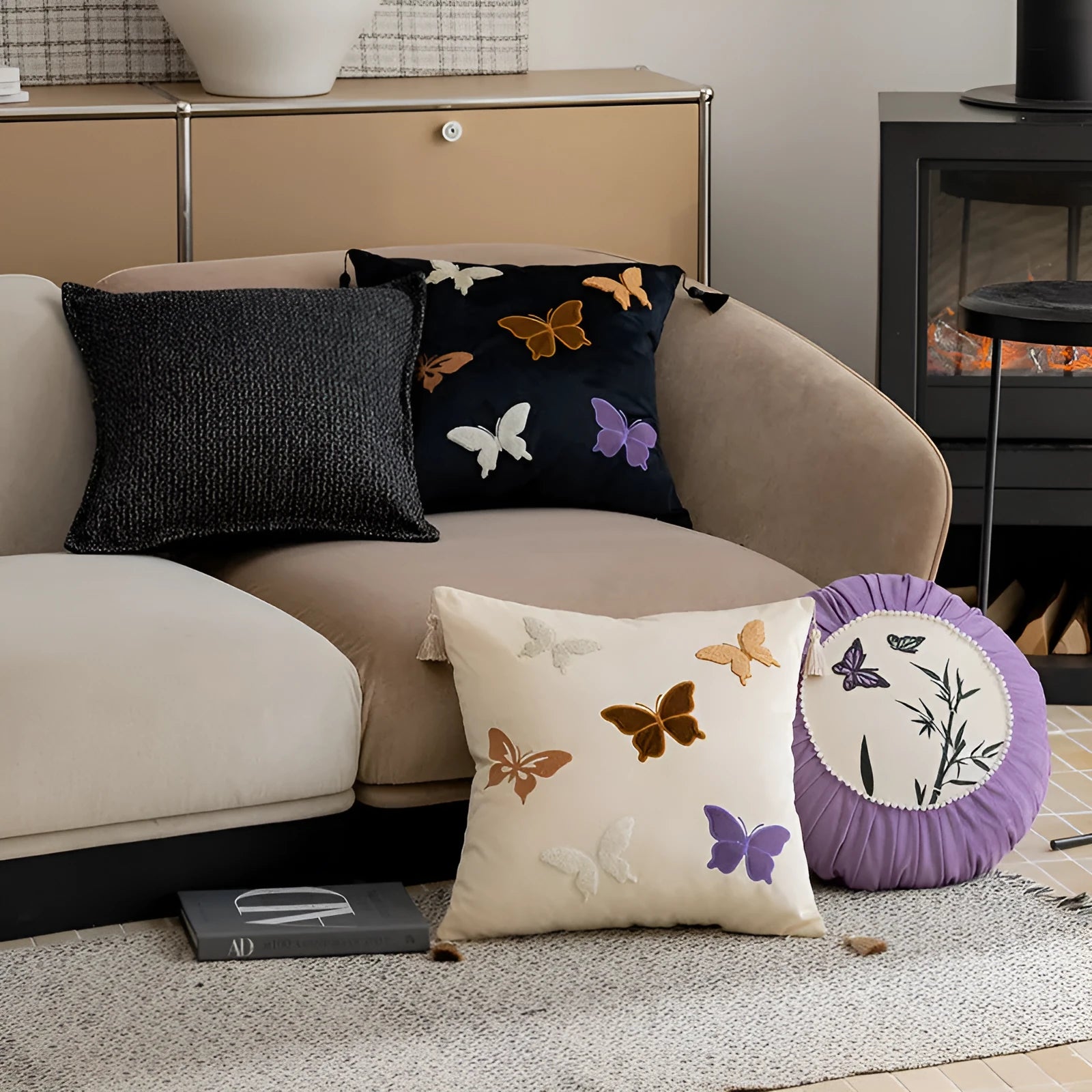 Square beige cushion with colourful embroidered butterfly and Chinese floral pattern.
