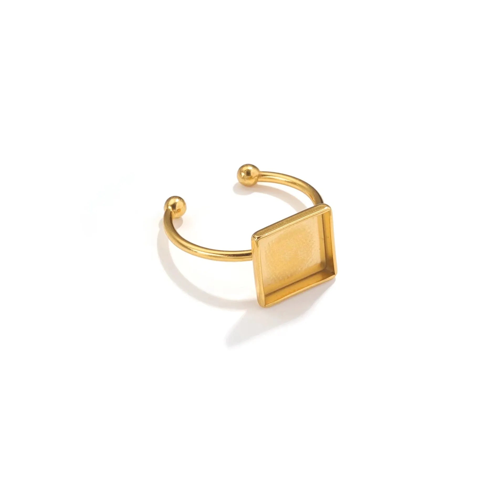 Golden-toned stainless steel ring holder with totem pattern and multiple shape options for jewellery organisation