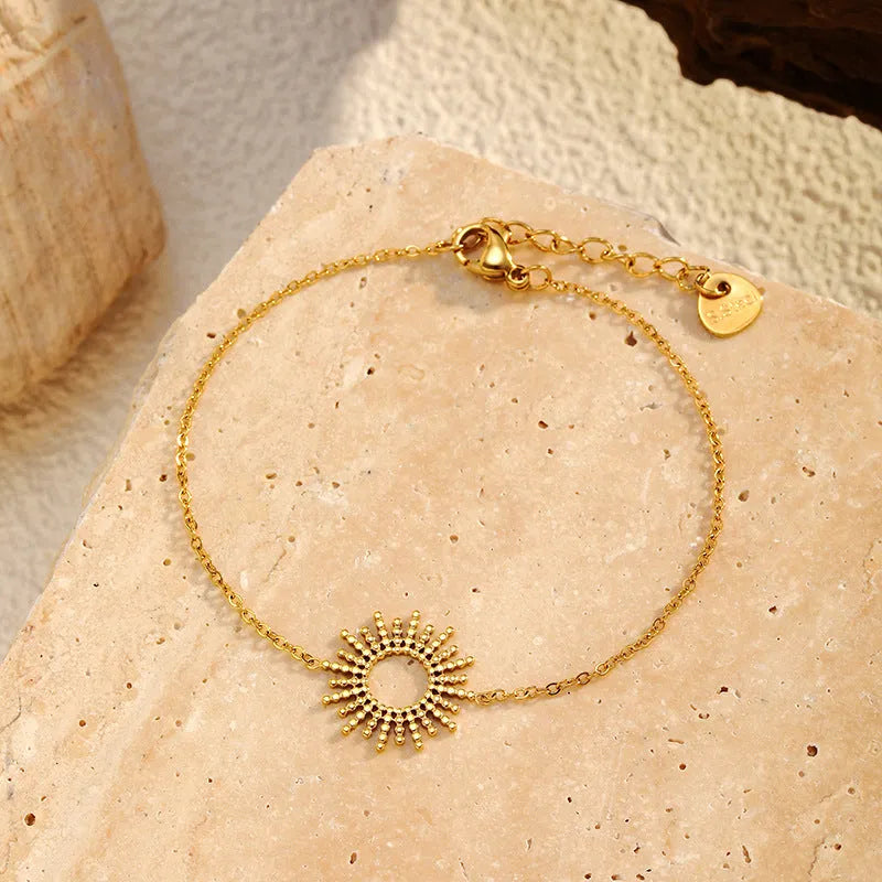 Sunflower Series gold tone geometric chain necklace and bracelet set for women.