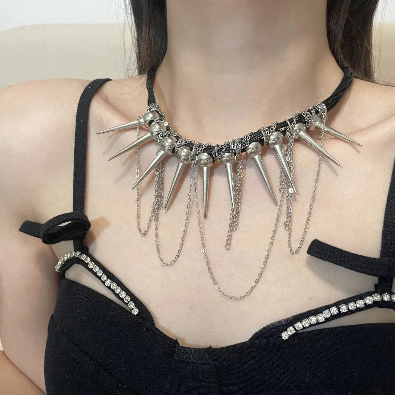 Women's casual leather necklace with electroplated rivets and winding round beads in picture colour.