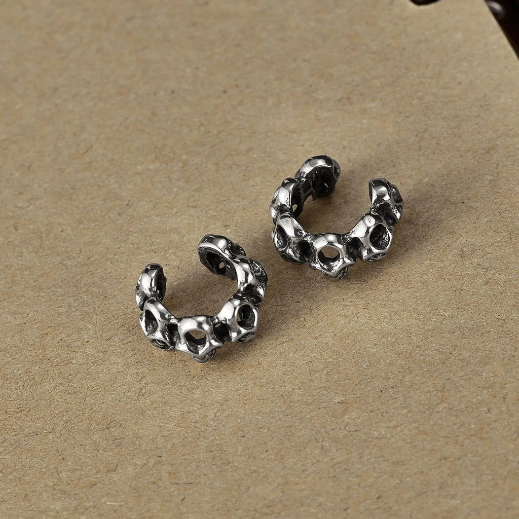 Stainless steel hollow skull ear clip earrings with geometric shape and retro design