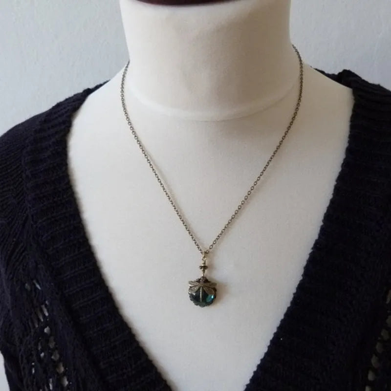 Yellow vintage bronze dragonfly pendant necklace on silver chain
