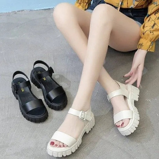 Women's beige peep toe sandals with an ankle strap buckle and a platform sole, shown from the side.