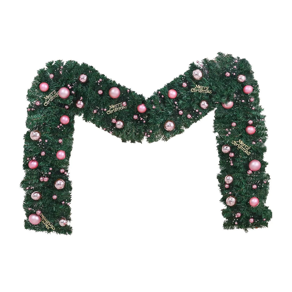2.7 metre long pink Christmas rattan decoration with 240 decorative heads draped on a mantelpiece