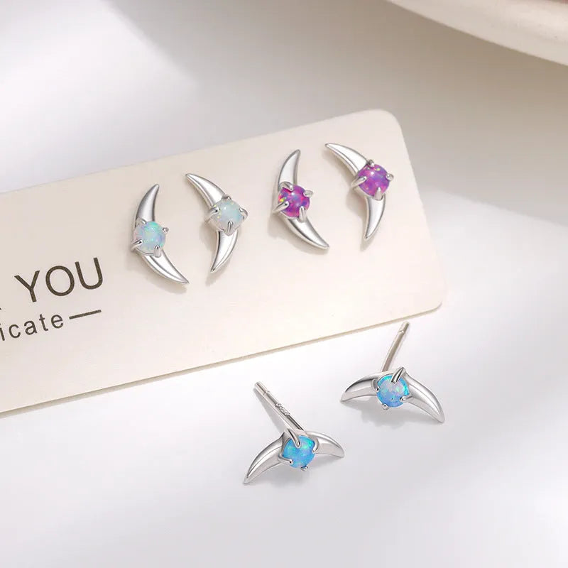 Women's geometric earrings in 925 silver with electroplated gold or platinum finish and coloured stone accents.