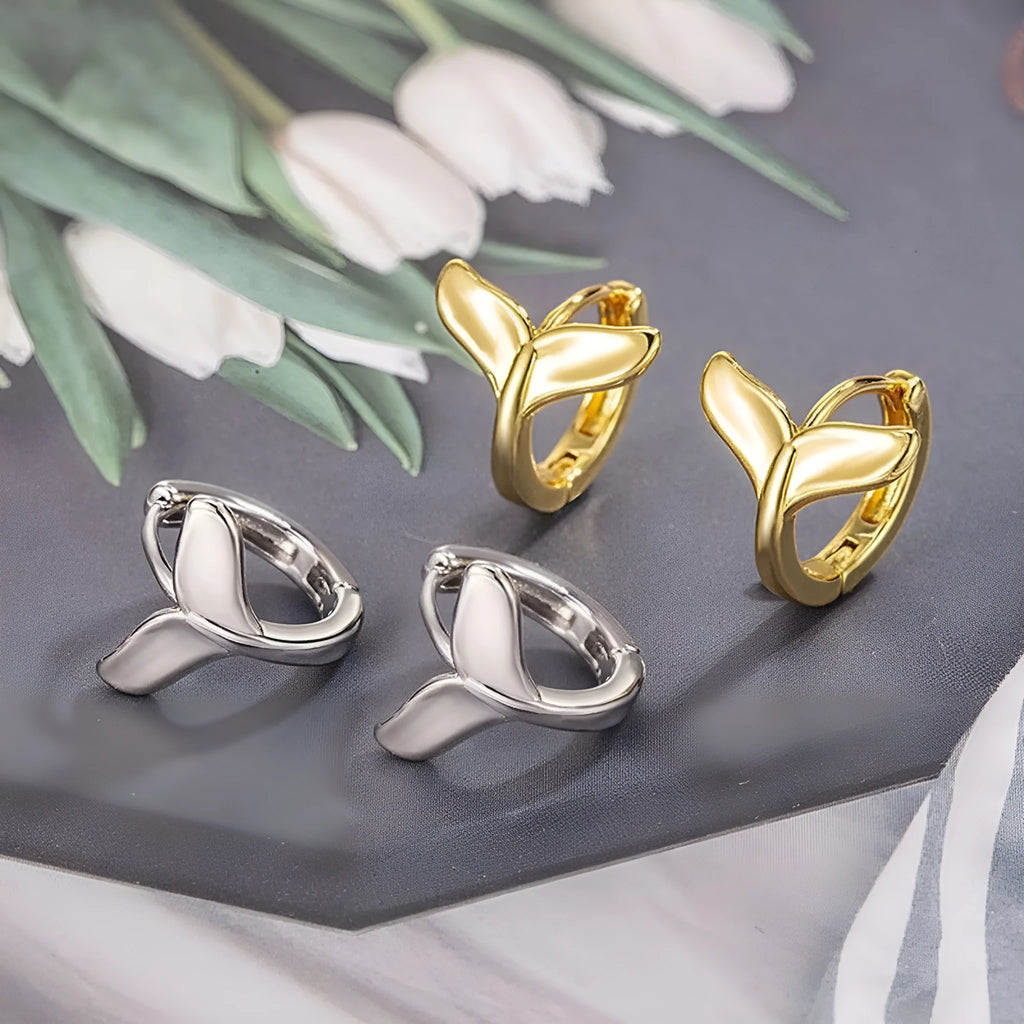 Women's fishtail design earrings in electroplated copper with gold colour finishes