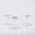 Transparent plastic spill-proof drinking cup on a table