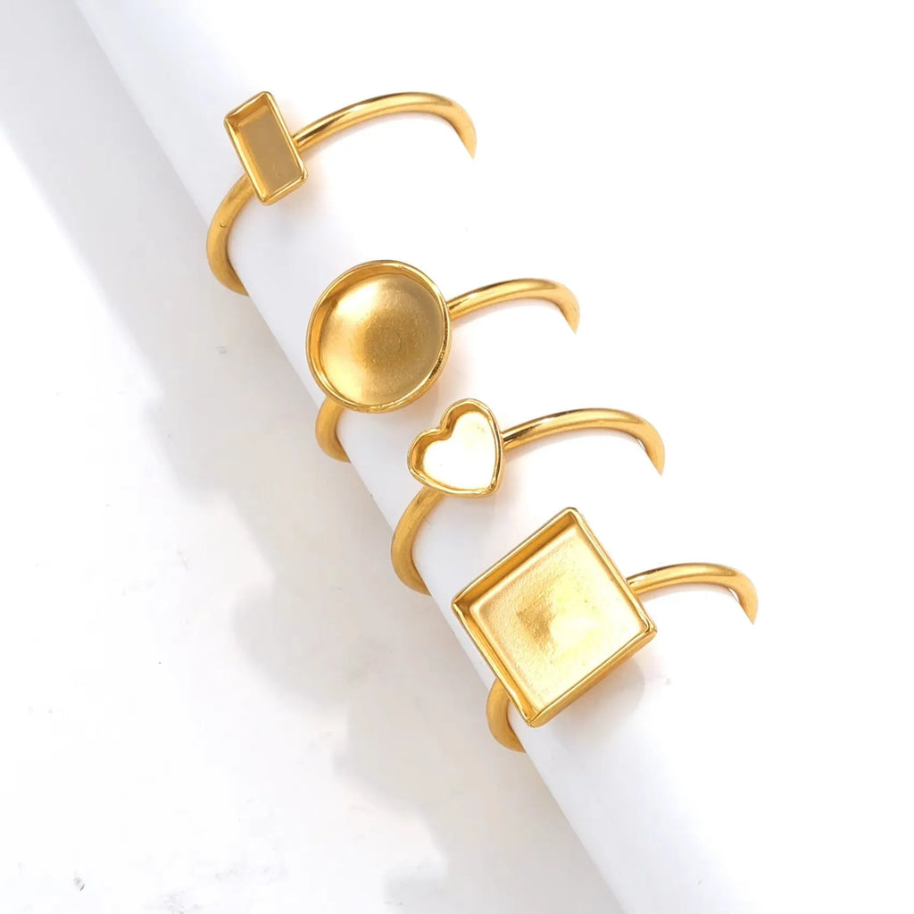 Golden-toned stainless steel ring holder with totem pattern and multiple shape options for jewellery organisation