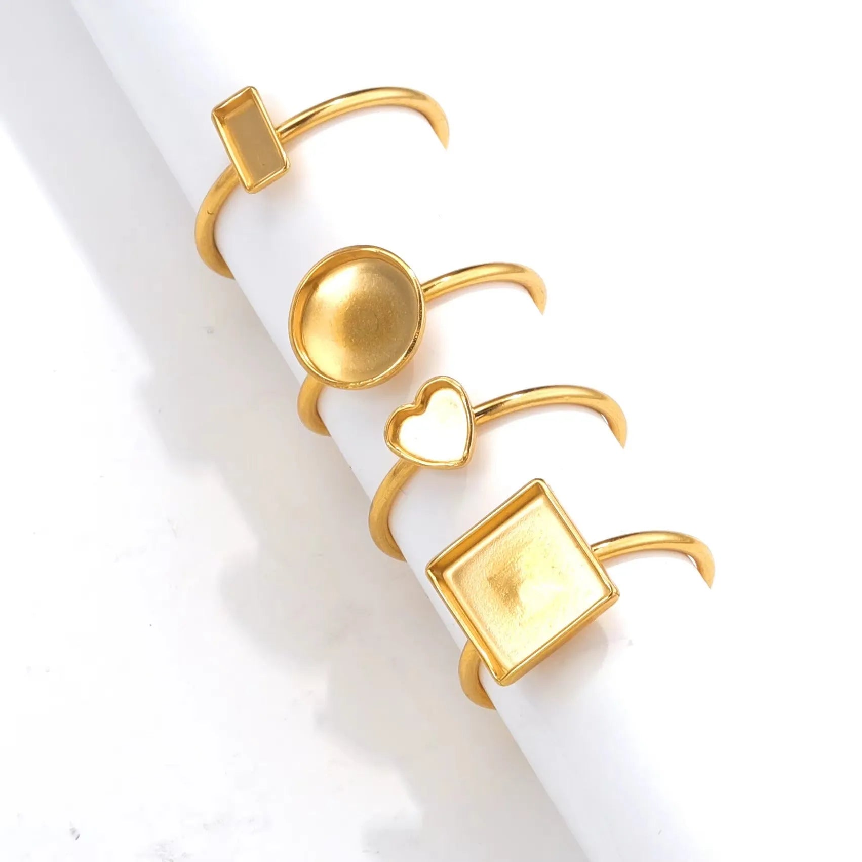 Golden-toned stainless steel ring holder with totem pattern and multiple shape options for jewellery organisation