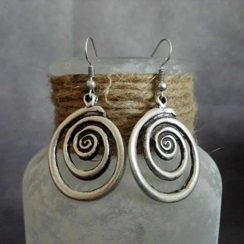Silver geometric spiral distressed earrings with tribal design measuring 2.6 by 5 cm