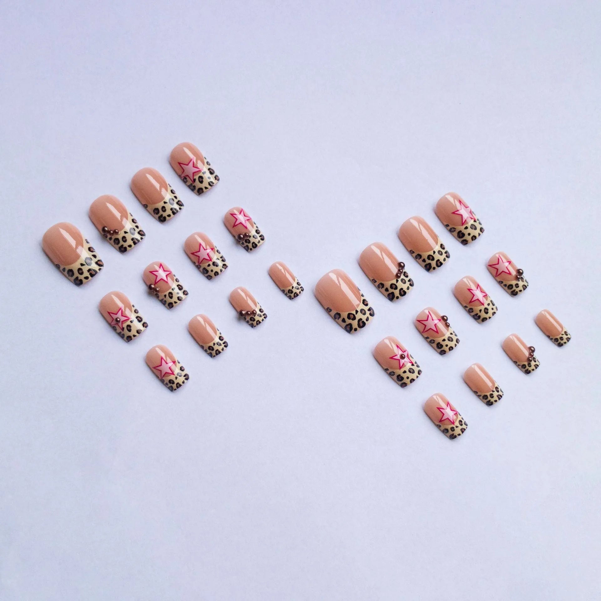 French style leopard print nail art strips with pearl and five-pointed star decorations for manicures.