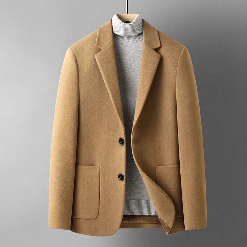 Men's slim-fit grey wool suit jacket with a notch lapel, shown on a hanger.