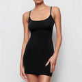 Black sleeveless sling dress with a slim sheath silhouette and short skirt.
