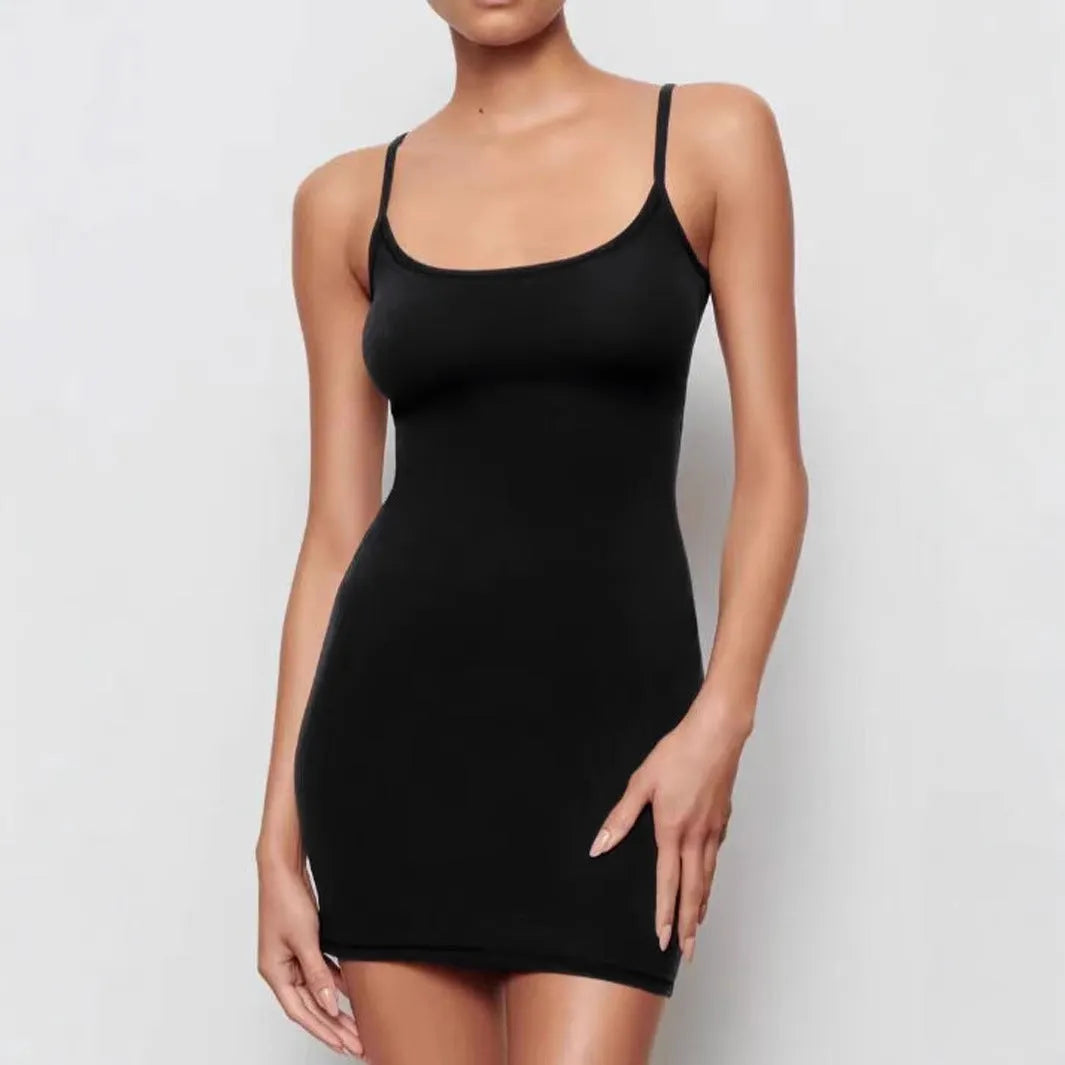 Black sleeveless sling dress with a slim sheath silhouette and short skirt.