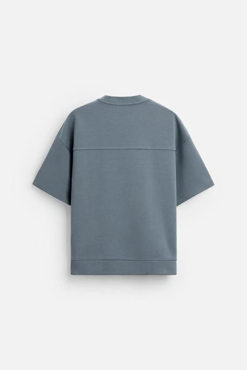 Loose blue polyester short sleeve top and matching shorts set on a hanger.