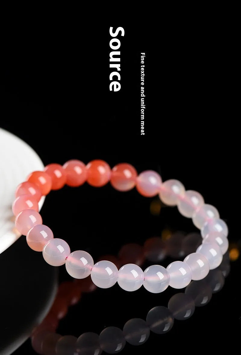 Natural gradient salt source colour Yanyuan agate bracelet with geometric beads on a wrist.