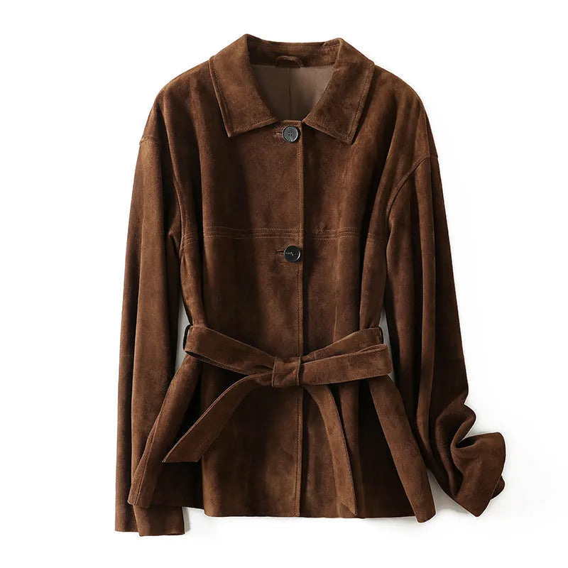 Yellow brown retro women's coat with Peter Pan collar and leather belt on a hanger.