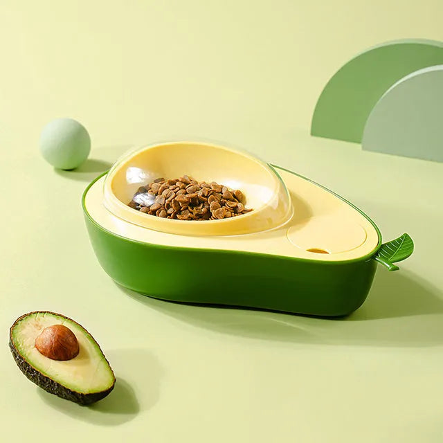 Green avocado-shaped pet feeder with automatic water bottle and separate food bowls