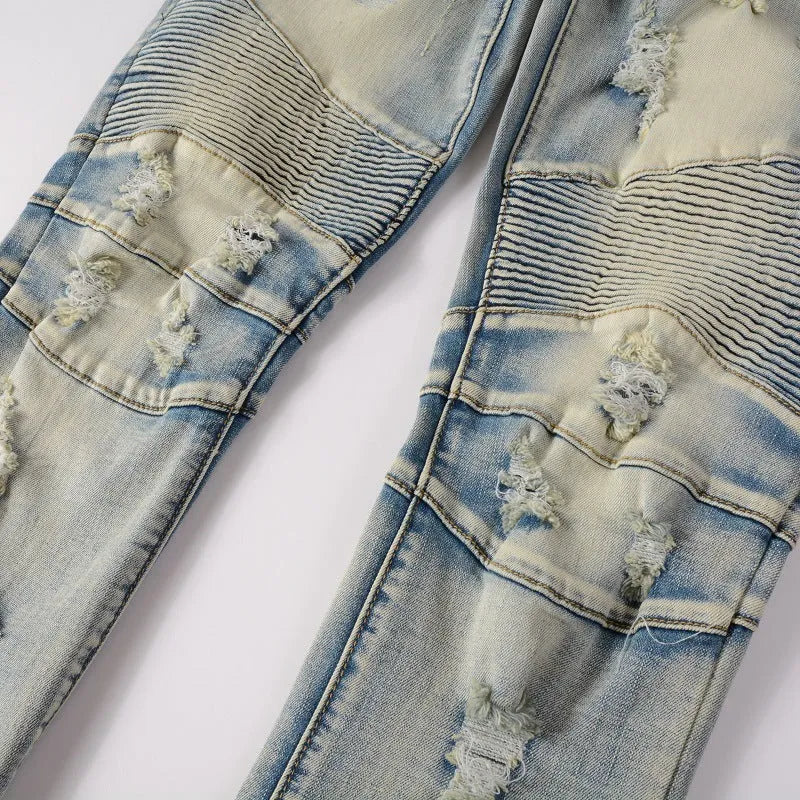 Light blue men's slim fit distressed jeans with hand-frayed detailing and a straight leg cut.