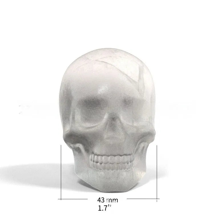 Silicone ice cube tray showing detailed 3D skull mould cavities