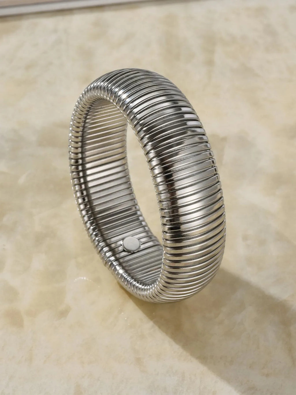 Women's titanium steel elastic bracelet with vertical stripe ring pattern in gold finish